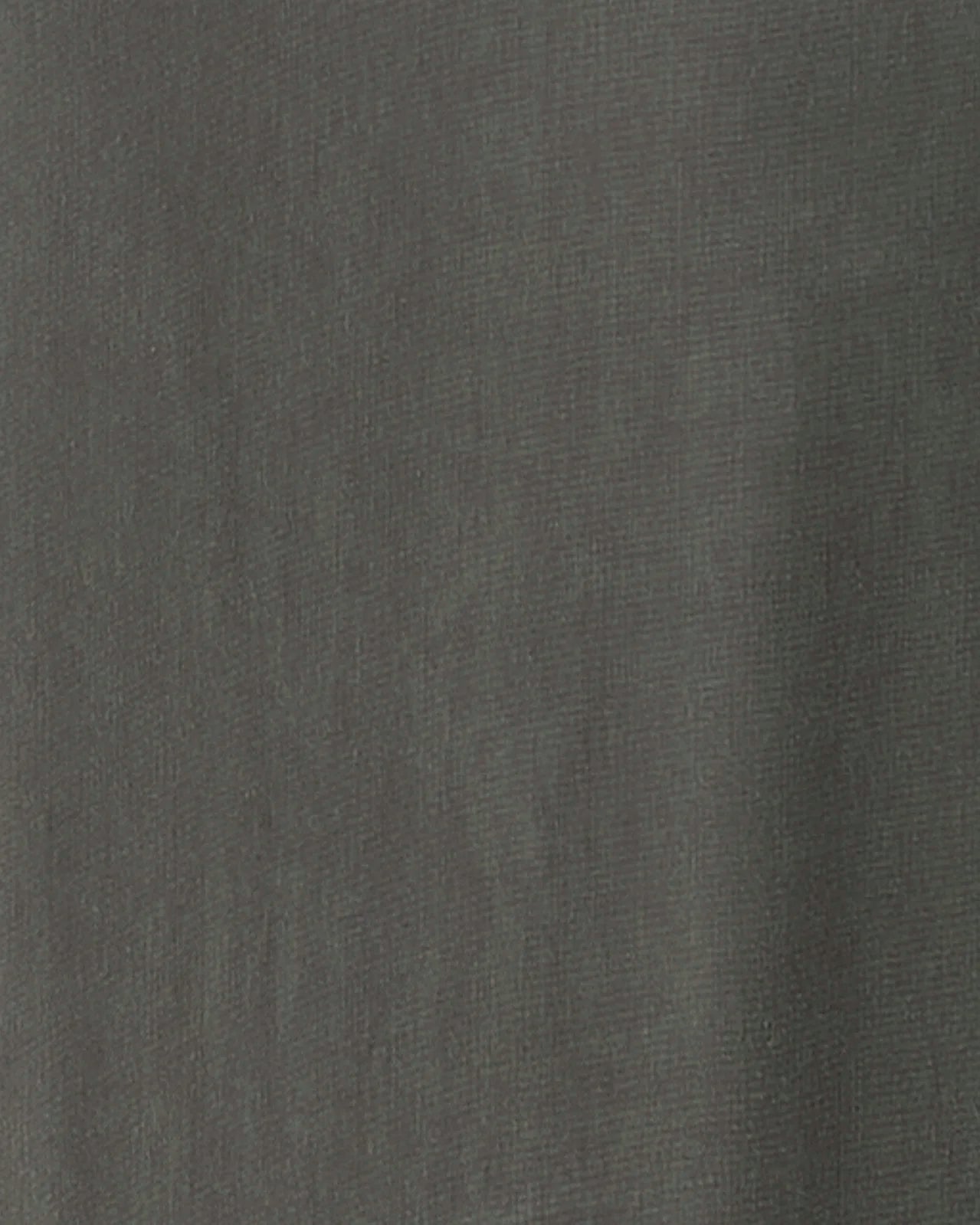 A close-up of a dark gray textured fabric surface.