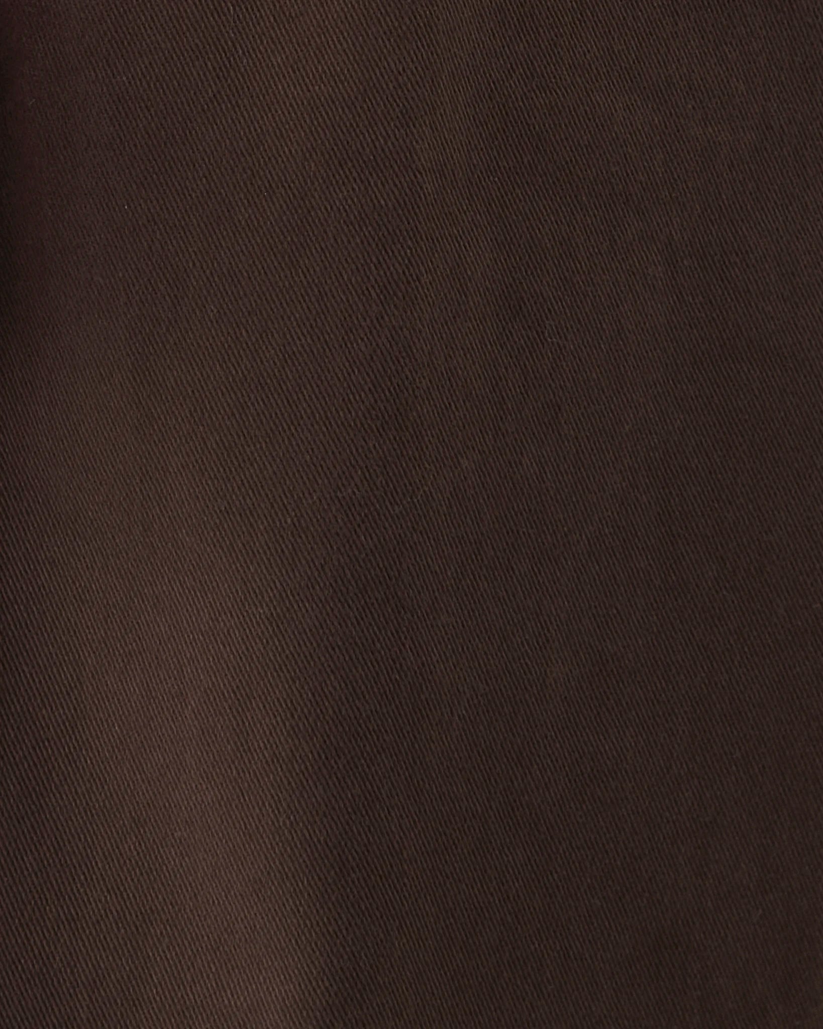 A close-up of a dark brown textured fabric with a fine diagonal twill weave.