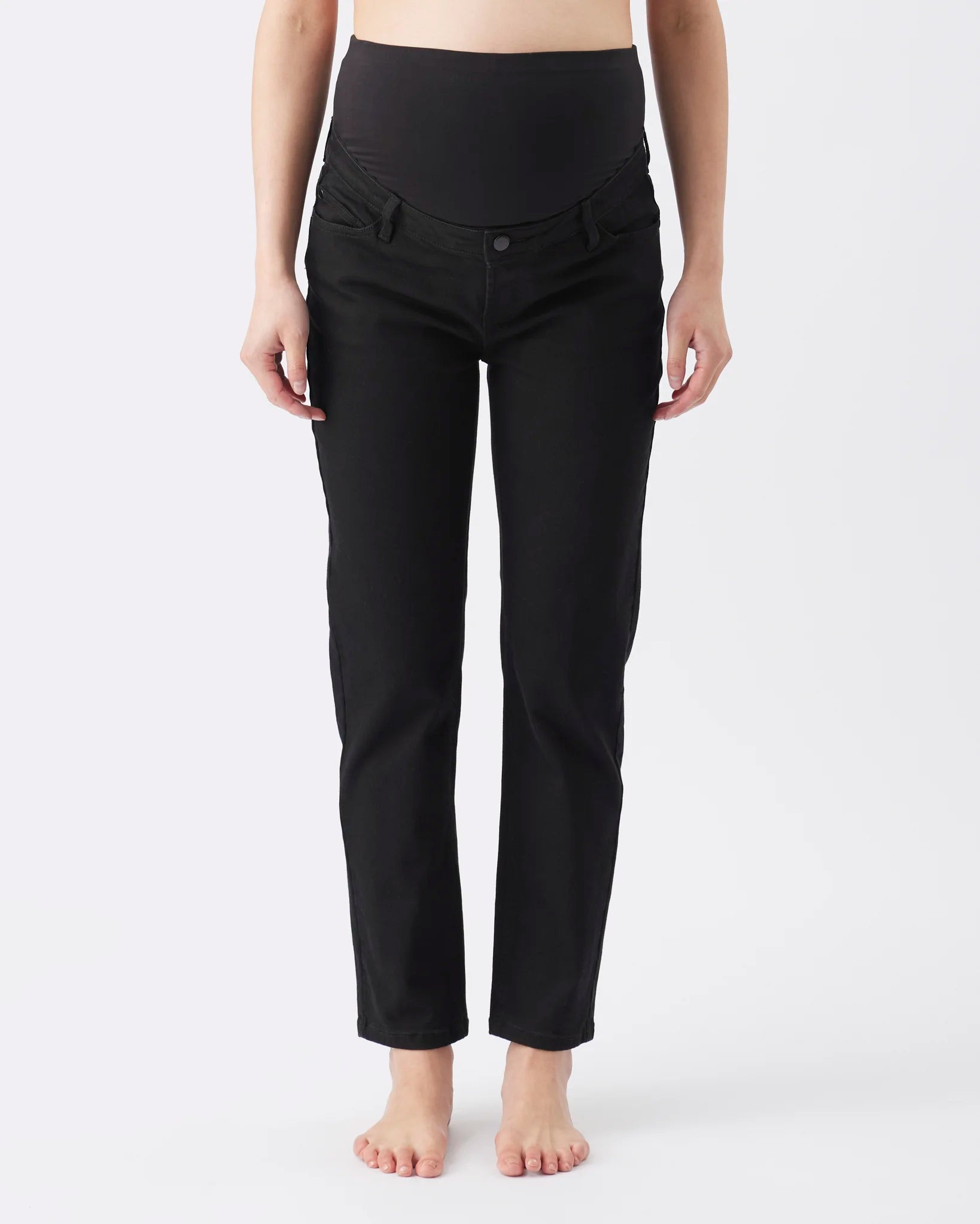 Black maternity pants with a wide, comfortable waistband, shown on a model from the waist down against a plain white background.