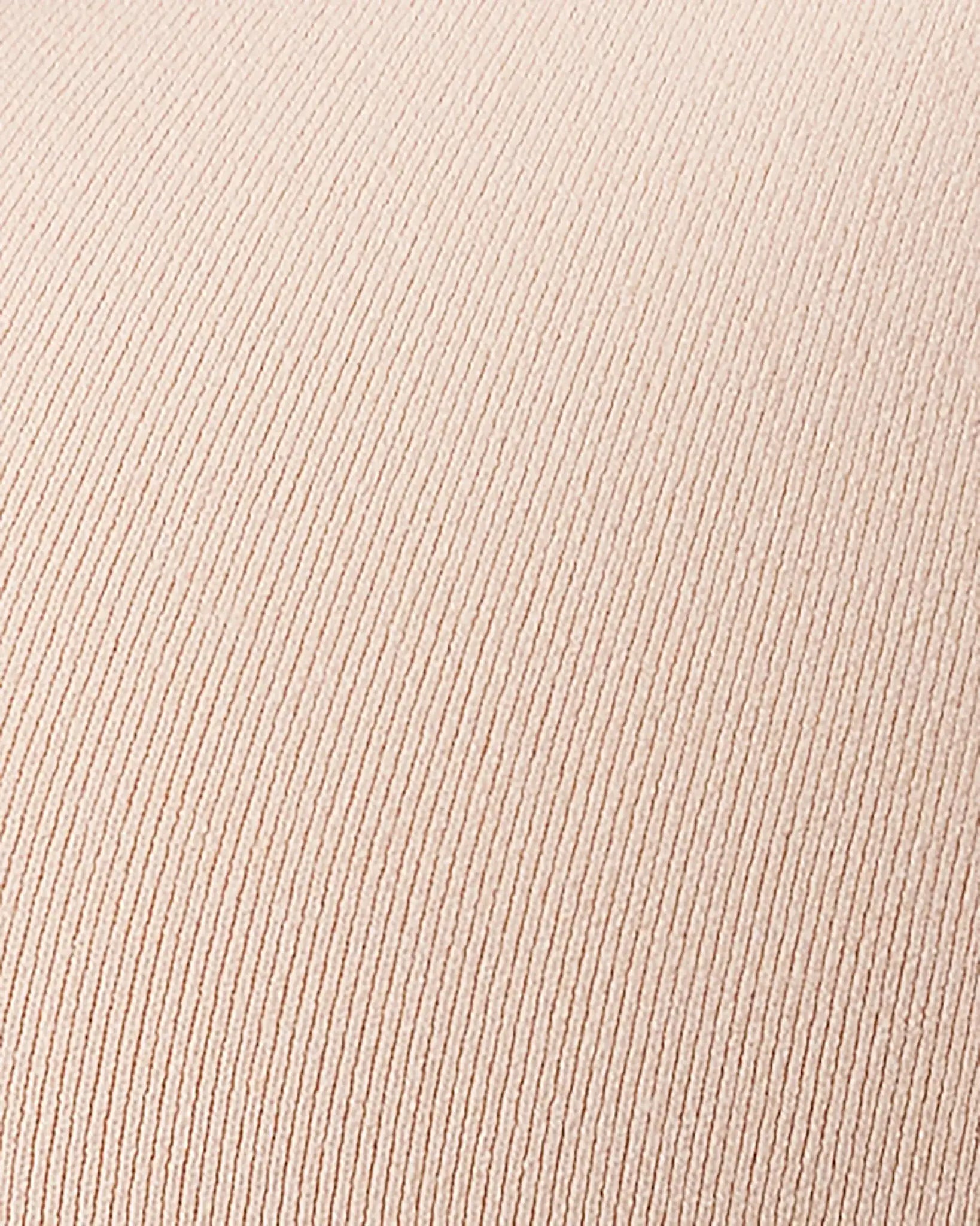 A close-up of a ribbed knit fabric in a light blush pink color, showing the fine vertical texture.