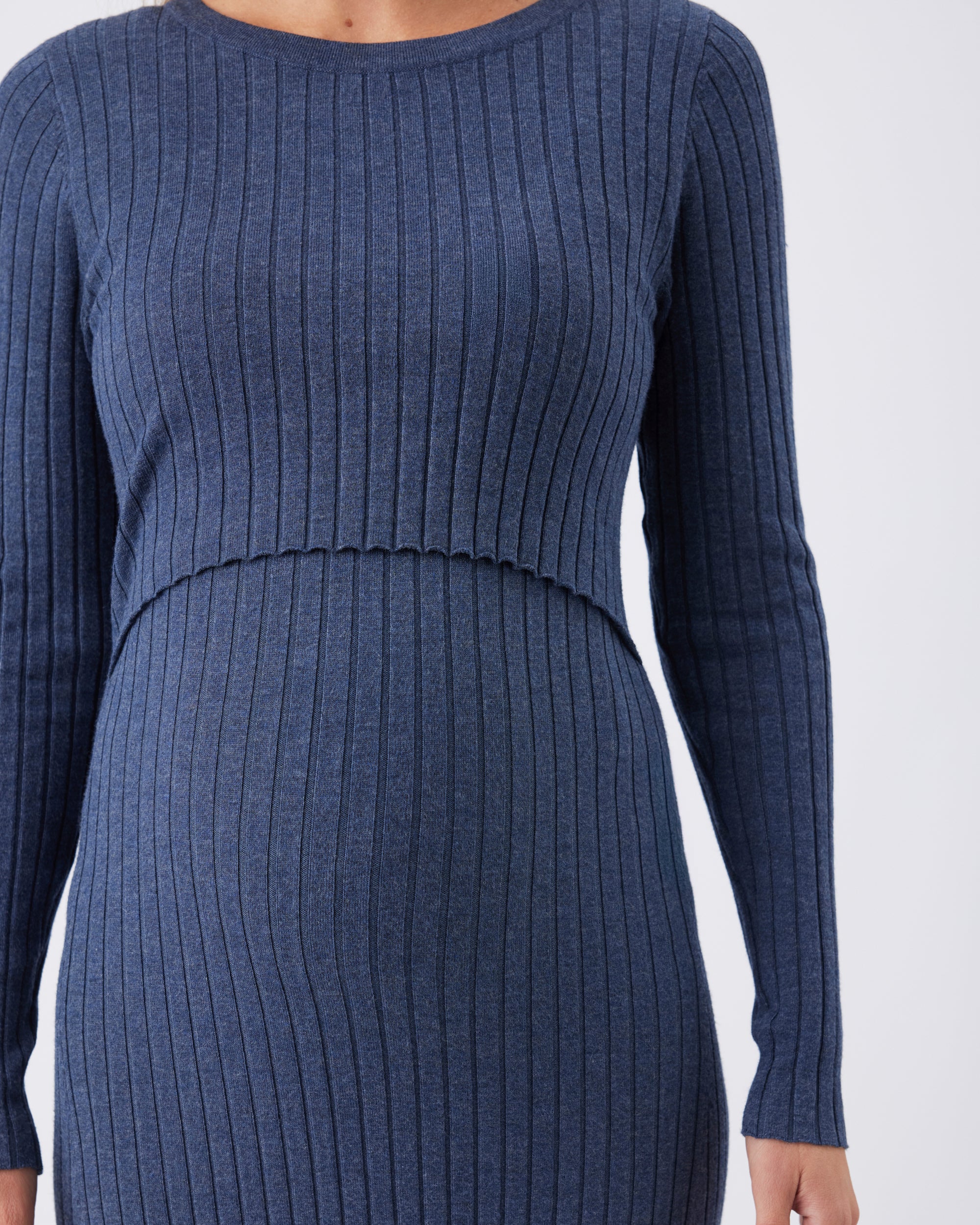 Closeup showing the nursing top of a blue knit ribbed sweater dress.