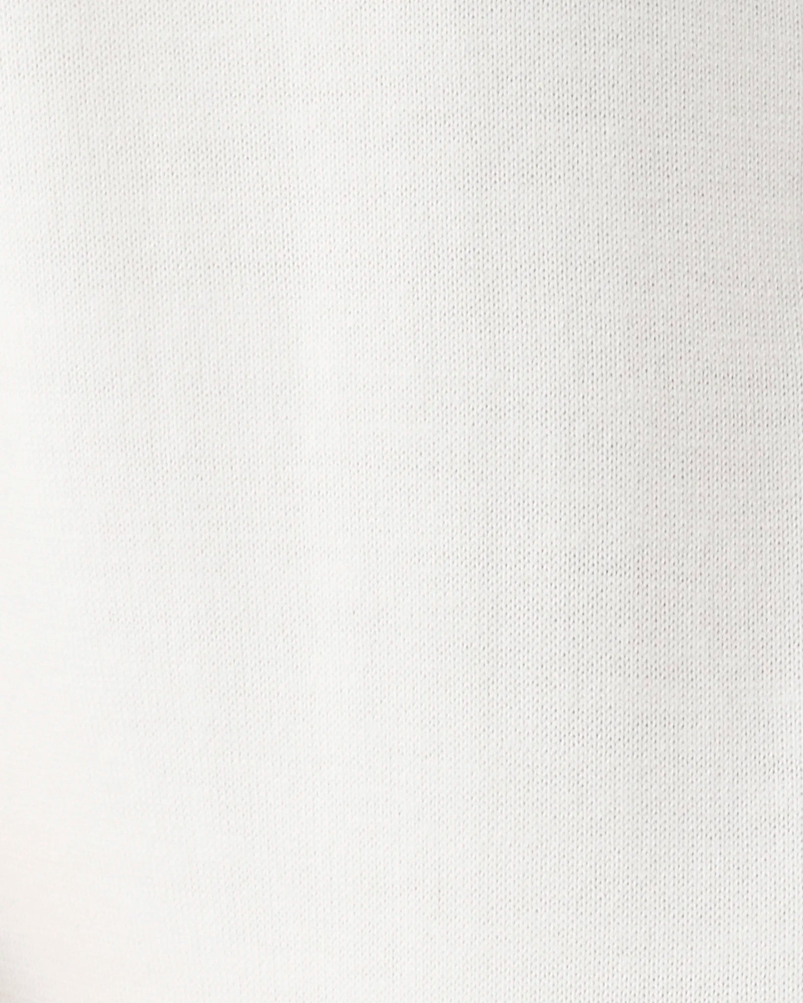 A close-up of a white textured fabric surface with a fine woven pattern.