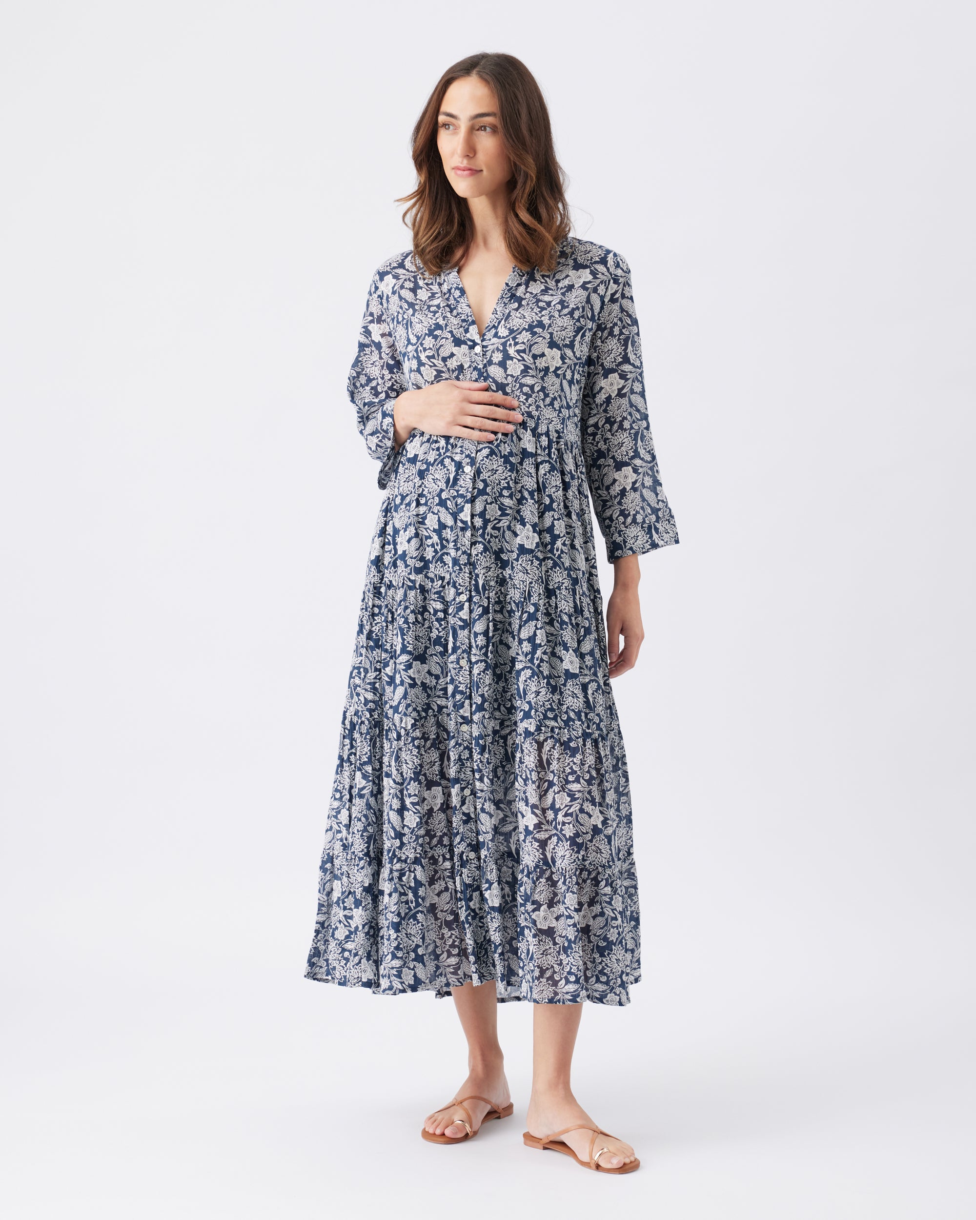 Woman wearing a floral dress on a white background