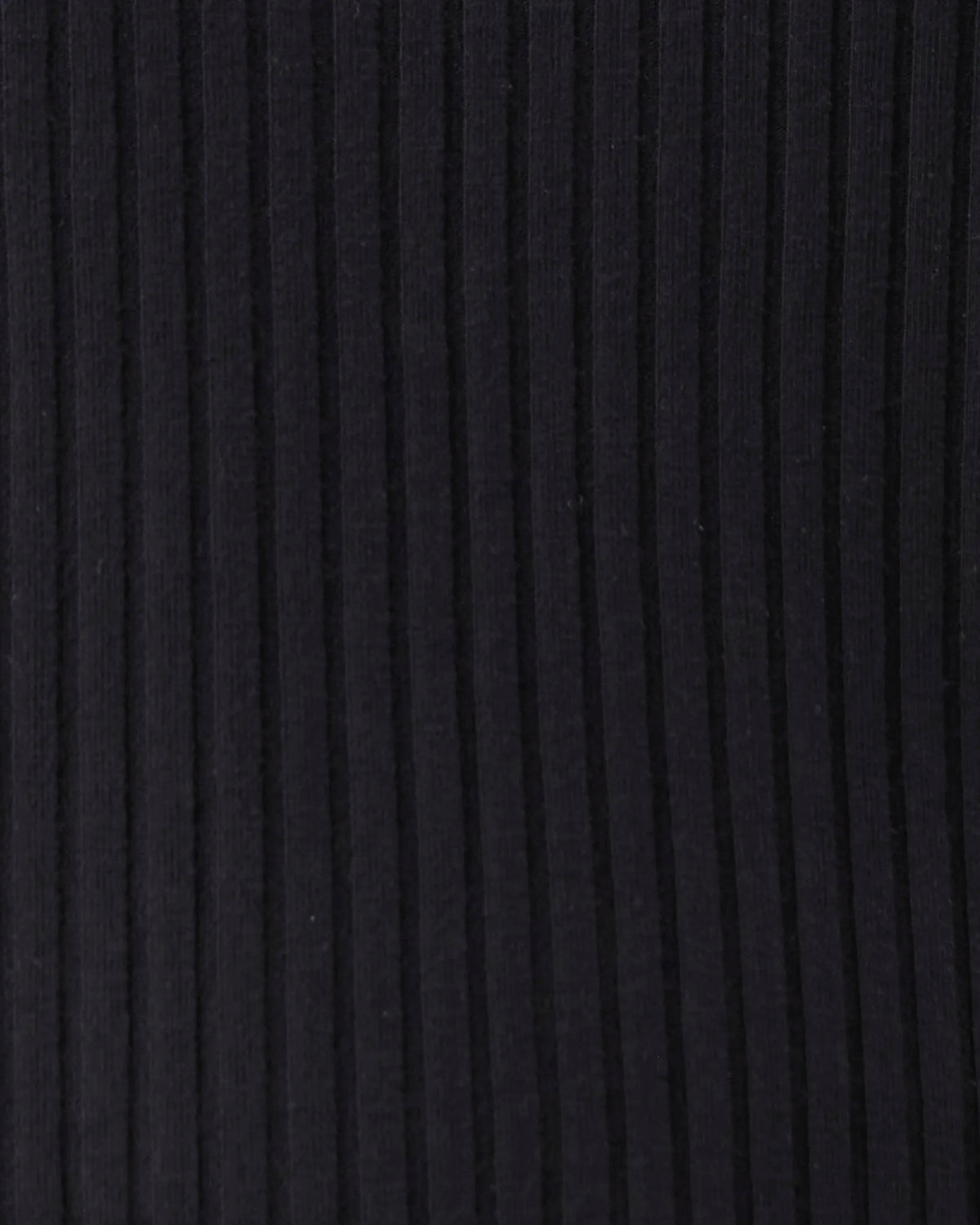 Close-up of a dark ribbed knit fabric texture with vertical channels.