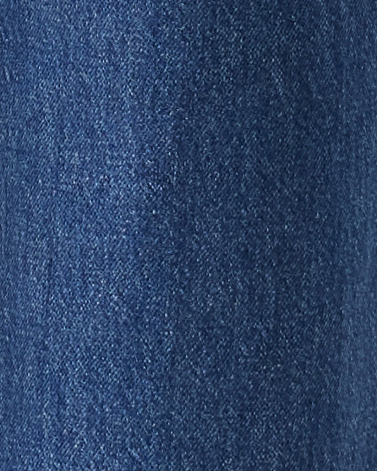 A close-up texture shot of dark blue denim fabric.