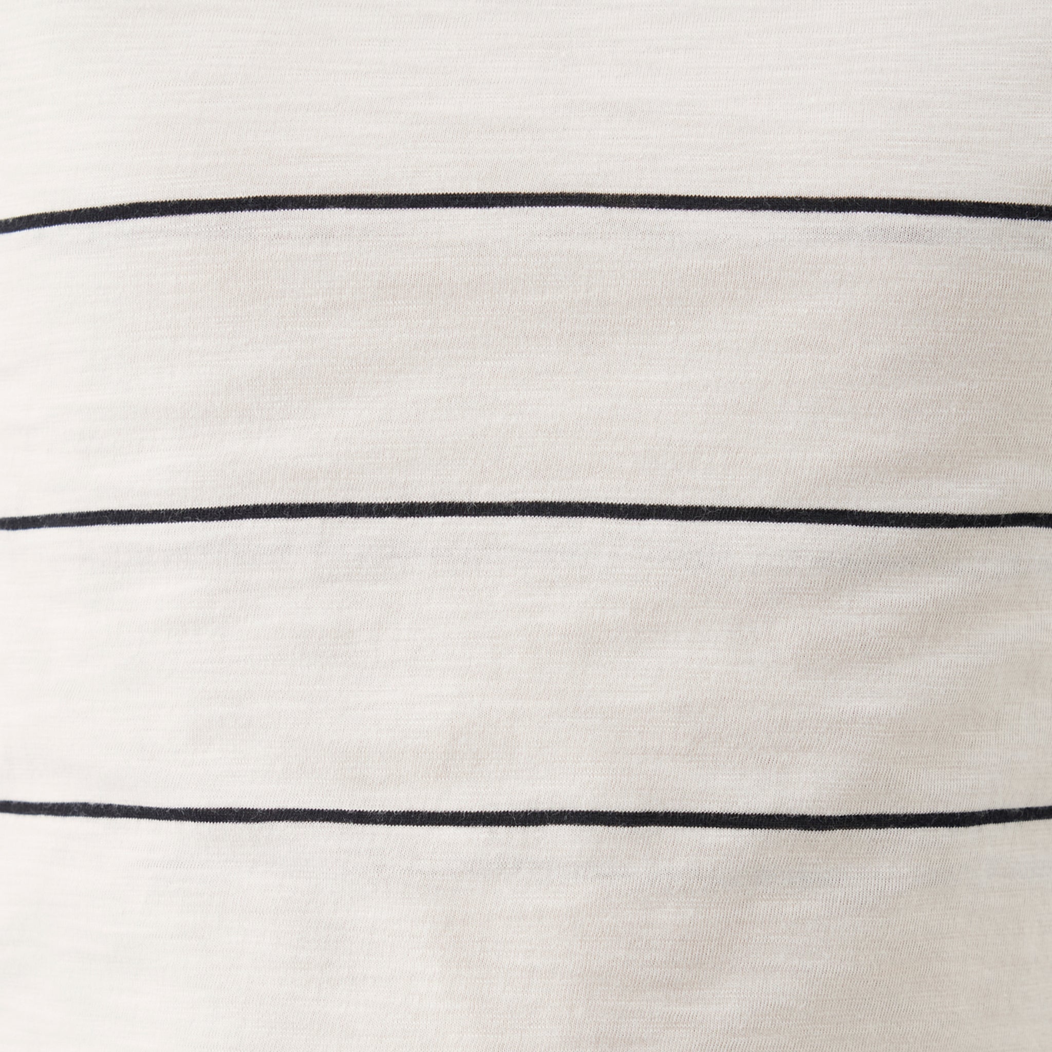 Close-up of a white fabric with black horizontal lines